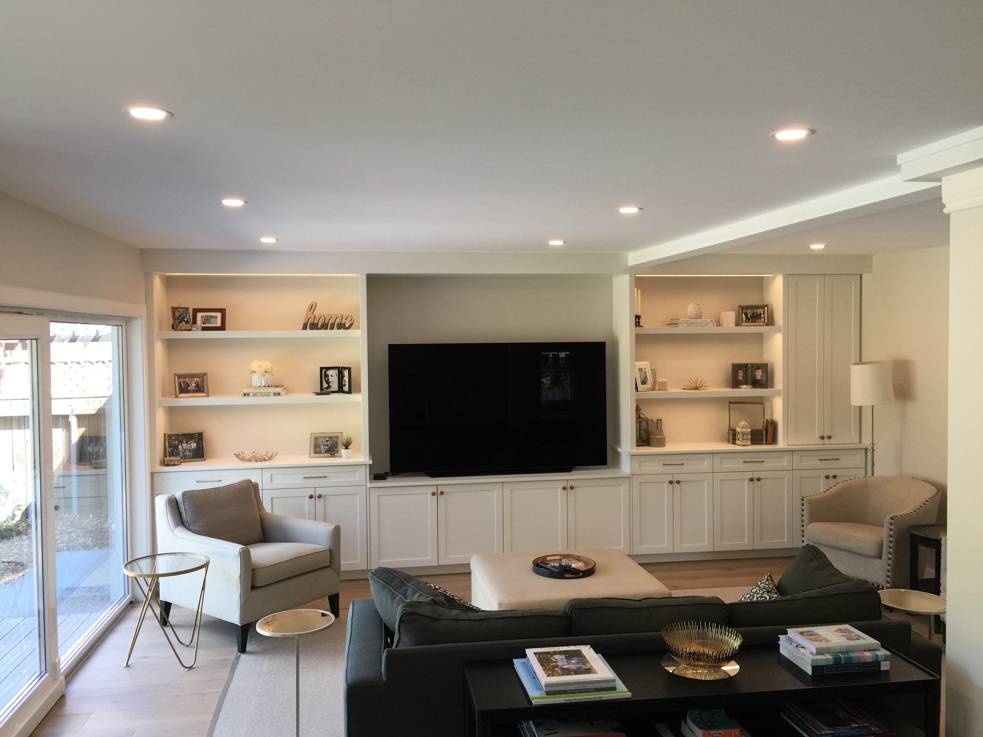 Custom built-in entertainment wall by Critical Cuts Carpentry